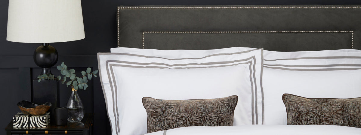 Woods Trieste Egyptian cotton bed linen in a dark autumn bedroom