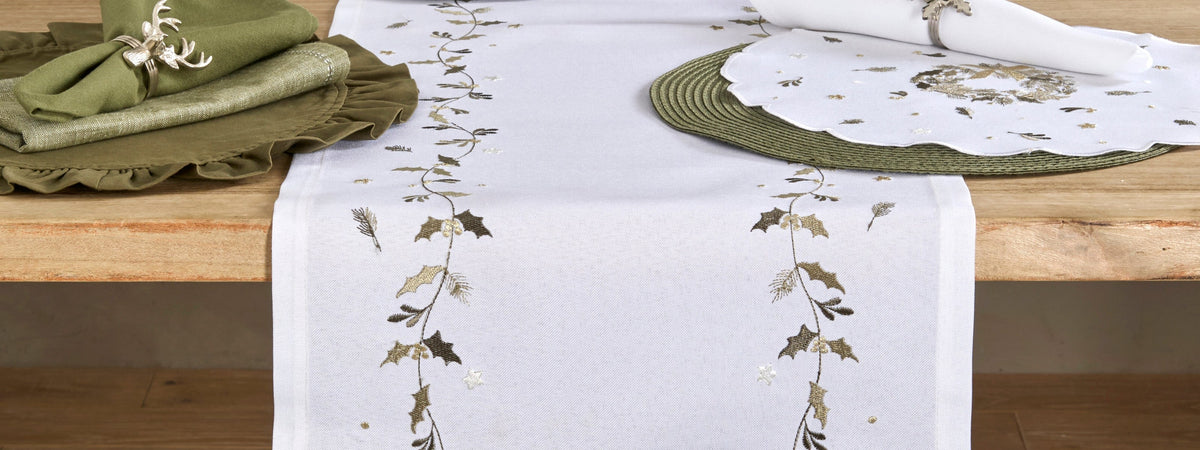 Embroidered Wreath Trail table runner on a laid Christmas table