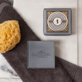 Gentlemen's Club Patchouli & Sandalwood Soap bar - Triple Milled Soap - Grey small square soap with grey decorative packaging. Lifestyle image