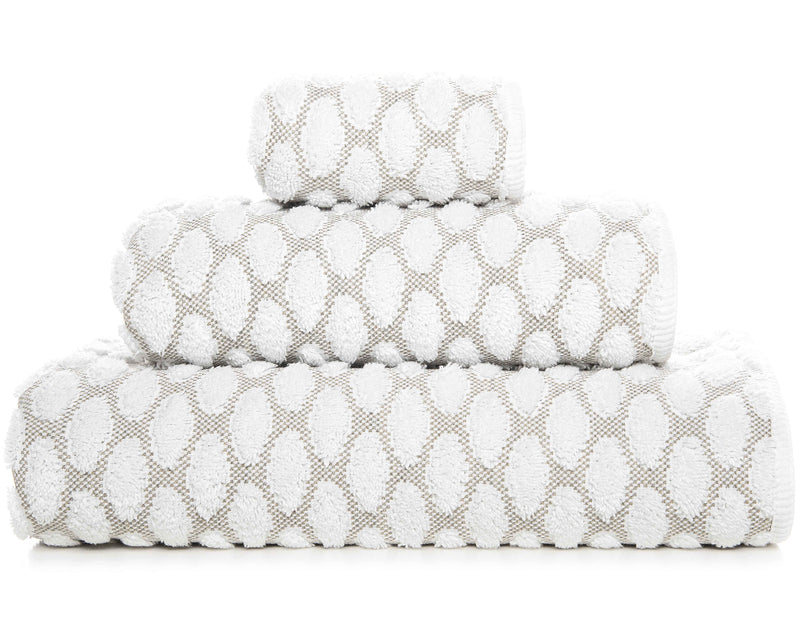 'Petalo' Cotton BathPetalo Bathe Towels  - Embossed white oval pattern on a light grey background with a white edge.